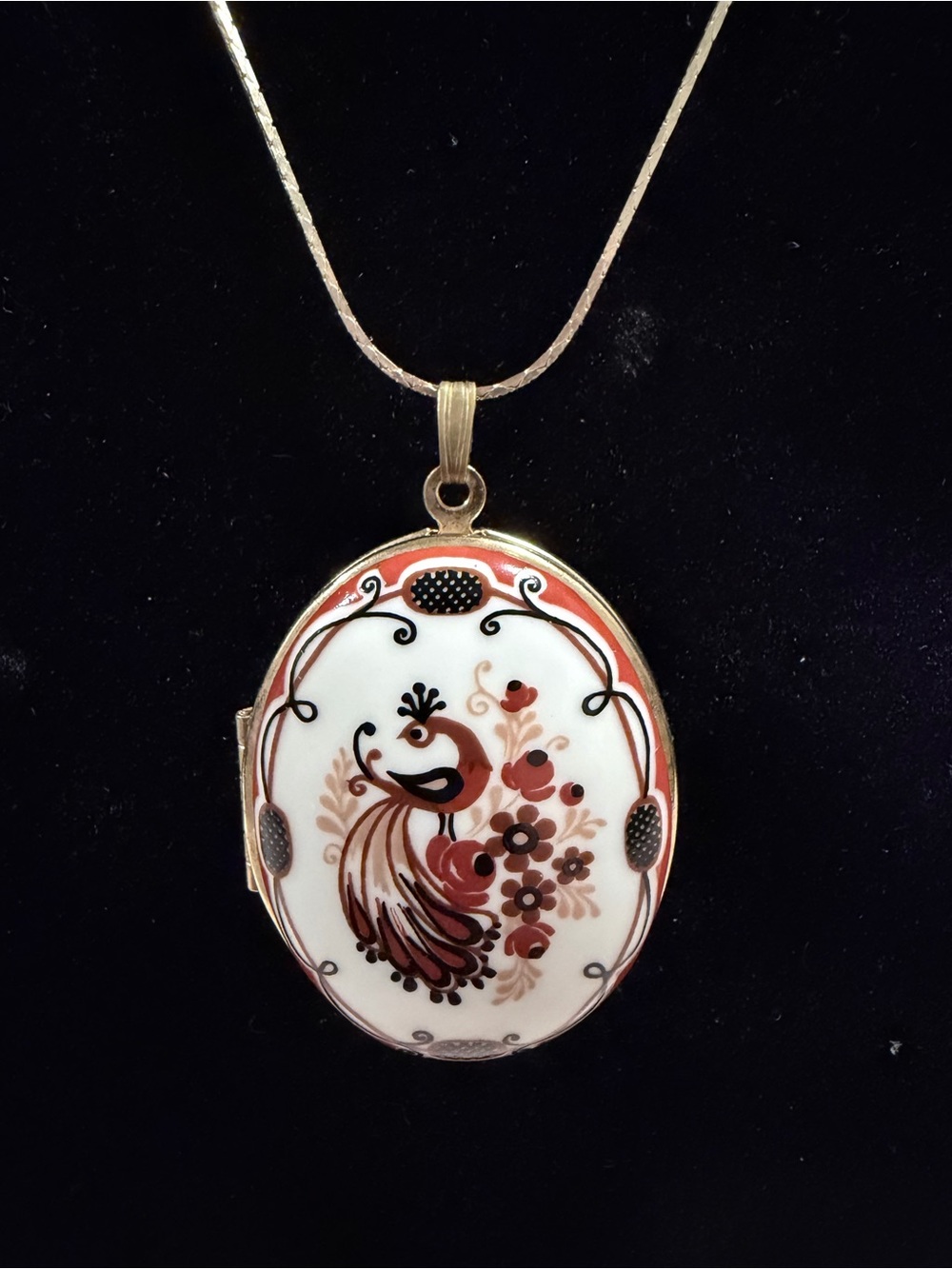 Vintage-Inspired Gold Locket Necklace with Red and White Peacock Motif